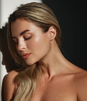Close-up of woman’s face highlighting smooth skin and facial contouring results